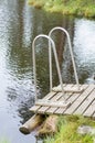 Wooden jetty with railings to the muskeg