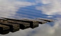 Wooden jetty with reflections