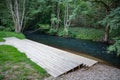 A wooden jetty at a rushing river. marina for canoeists in Central Europe Royalty Free Stock Photo