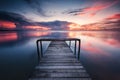 A wooden jetty with stunning sunset background Royalty Free Stock Photo