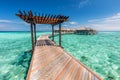 Wooden jetty towards water villas in Maldives. Royalty Free Stock Photo