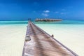 Wooden jetty towards water villas in Maldives. Royalty Free Stock Photo