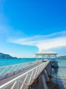 Wooden jetty walkway with pavillion to the sea