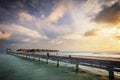 Wooden jetty and water villas. Maldives island resort at sunset Royalty Free Stock Photo