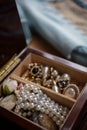 A wooden jewelry box with vintage costume jewelry Royalty Free Stock Photo