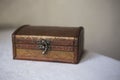 Wooden jewelry box with vintage lock. Royalty Free Stock Photo