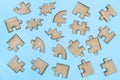 Wooden Jigsaw Puzzle  parts on blue background Royalty Free Stock Photo