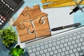 Wooden Jigsaw Puzzle Pieces Forming a House Shape Royalty Free Stock Photo