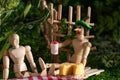 Wooden jointed doll with green hat from silly putty