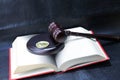Wooden Judge Gavel And Bitcoin On Open Book