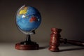 Wooden Judge gavel and globe close-up. International law and justice court concept Royalty Free Stock Photo