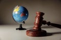 Wooden Judge gavel and globe on the desk. International law and justice court concept Royalty Free Stock Photo