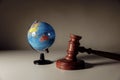 Wooden Judge gavel and globe. International environment law concept Royalty Free Stock Photo