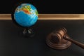 Wooden Judge gavel and globe. International Environment law. Law and justice court concept Royalty Free Stock Photo