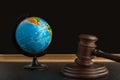 Wooden Judge gavel and globe. International Environment law. Law and justice court concept Royalty Free Stock Photo