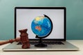 Wooden judge gavel and globe on laptop. International law and justice court concept Royalty Free Stock Photo