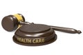 Wooden judge gavel with health care word