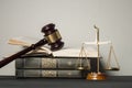 Law concept. Wooden judge gavel with law books ,scales of justice on table in a courtroom or enforcement office. Royalty Free Stock Photo