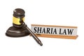 Wooden judge gavel and sharia law banner