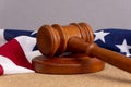 Wooden judge`s gavel on the background of the American flag. Concept: claim and compensation for damages, court session, announcem Royalty Free Stock Photo