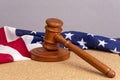 Wooden judge`s gavel on the background of the American flag. Concept: claim and compensation for damages, court session, announcem Royalty Free Stock Photo