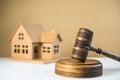 Wooden judge`s gavel. In the background the scales of justice and books. Royalty Free Stock Photo