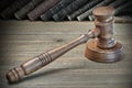 Wooden Judges Gavel And Old Law Books On Wooden Background