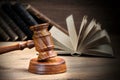 Wooden Judges Gavel And Old Law Books On Wooden Background