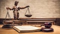 Wooden judges gavel and open law book in a Royalty Free Stock Photo