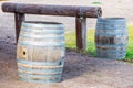 Wooden kegs at hitching post Royalty Free Stock Photo