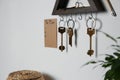 Wooden key holder and to do list on grey wall indoors. Space for text Royalty Free Stock Photo