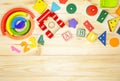 Wooden kids cubes ABC on wooden table. Educational toys blocks, pyramid, pencils, numbers. Toys for kindergarten, preschool or day Royalty Free Stock Photo