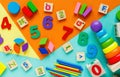 Wooden kids toys on colourful paper. Educational toys blocks, pyramid, pencils, numbers, train. Toys for kindergarten Royalty Free Stock Photo
