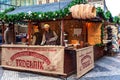 Wooden kiosk selling fresh baked trdelnik in Prague.