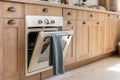 Wooden kitchen in modern interior with contemporary furniture Royalty Free Stock Photo