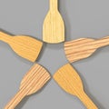 Wooden kitchen spatulas for cooking food isolated on gray background 3d render. Realistic set of empty natural bamboo