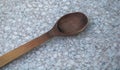 Wooden kitchen spoon on stone countertop Royalty Free Stock Photo