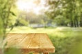 Wooden kitchen tabletop and blurred outside garden background. Royalty Free Stock Photo