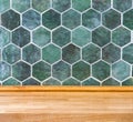 wooden kitchen tabletop and vintage green tile Royalty Free Stock Photo