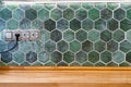 wooden kitchen tabletop and vintage green tile Royalty Free Stock Photo