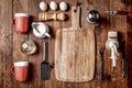 Wooden kitchen tools on dark brown table background. Royalty Free Stock Photo