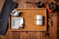 Wooden kitchen tools on dark brown table background. Royalty Free Stock Photo