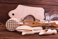 Wooden kitchen tools in a jar lie on a brown background Royalty Free Stock Photo