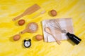 Wooden kitchen utensils eggs, sea salt, mixer. cooking food top view on a yellow background Royalty Free Stock Photo