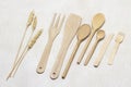 Wooden kitchen utensils set. Spoons, forks, spatula and sprigs of wheat Royalty Free Stock Photo