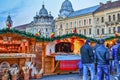 Wooden kitchen utensils and smoked meat at the Christmas market stalls