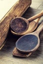 Wooden kitchen utensils on the table. Recipe book wooden spoon in a retro style on wooden table Royalty Free Stock Photo