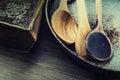 Wooden kitchen utensils on the table. Recipe book wooden spoon in a retro style on wooden table Royalty Free Stock Photo