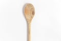 Wooden kitchen utensils. Wooden spoon used in the kitchen isolated over white background. Royalty Free Stock Photo