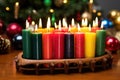 wooden kwanzaa kinara filled with variously colored candles